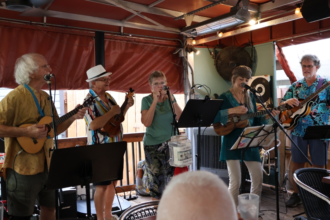 connie manson playing ukulele with others
